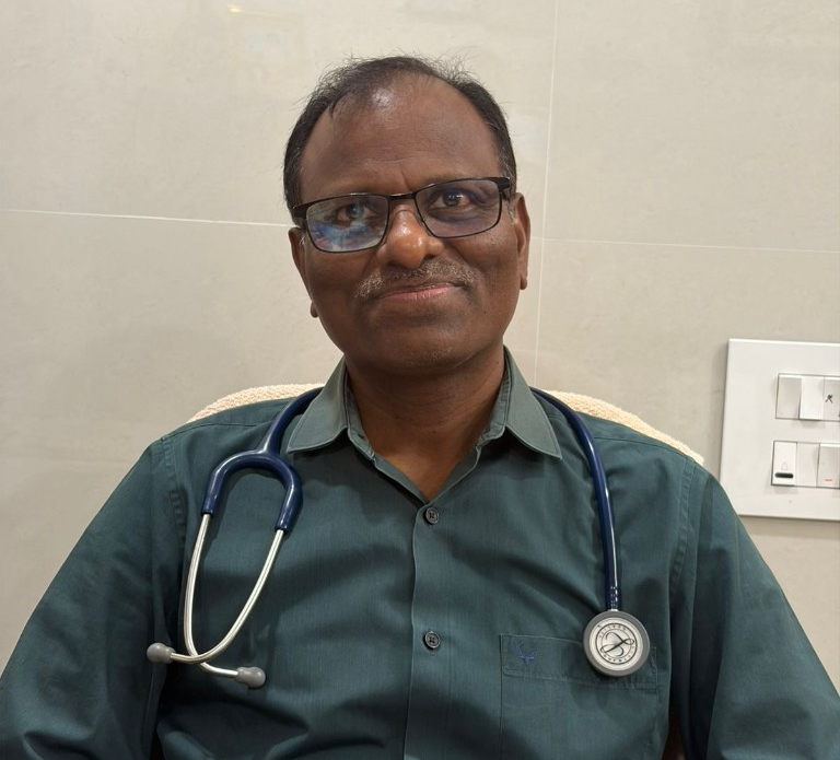 Dr. Vakamullu Sreerama Murthy examining a child